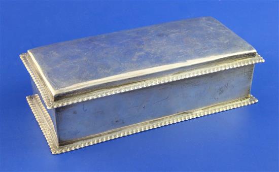 An Edwardian silver mounted cigarette box, 8in.